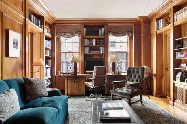 The wood-paneled library
